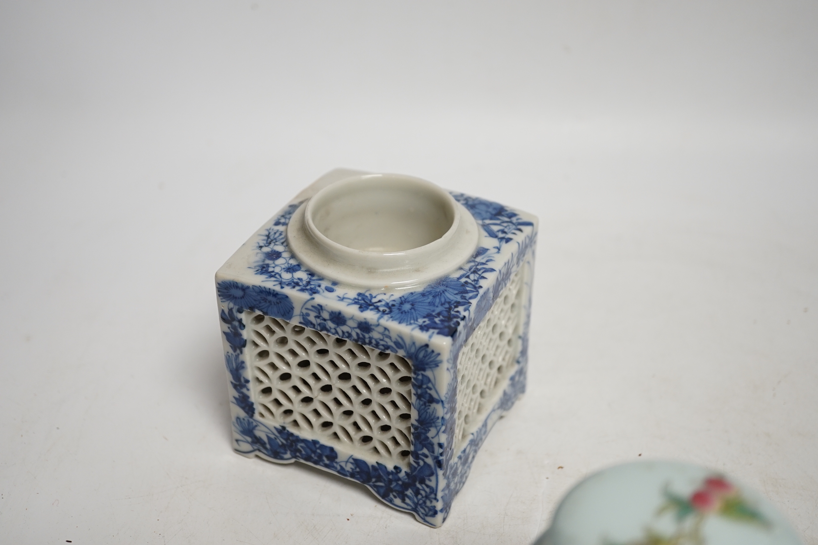 A collection of Chinese ceramics including celadon bowl decorated in low relief with fish, famille rose tea bowls and a jar, largest 12cm high